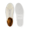Cream leather sneaker with brown suede heel and white rubber sole, top and bottom view