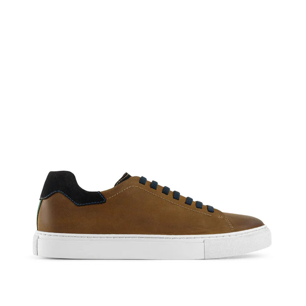 Brown leather low-top sneaker with black heel, dark laces, and white rubber sole