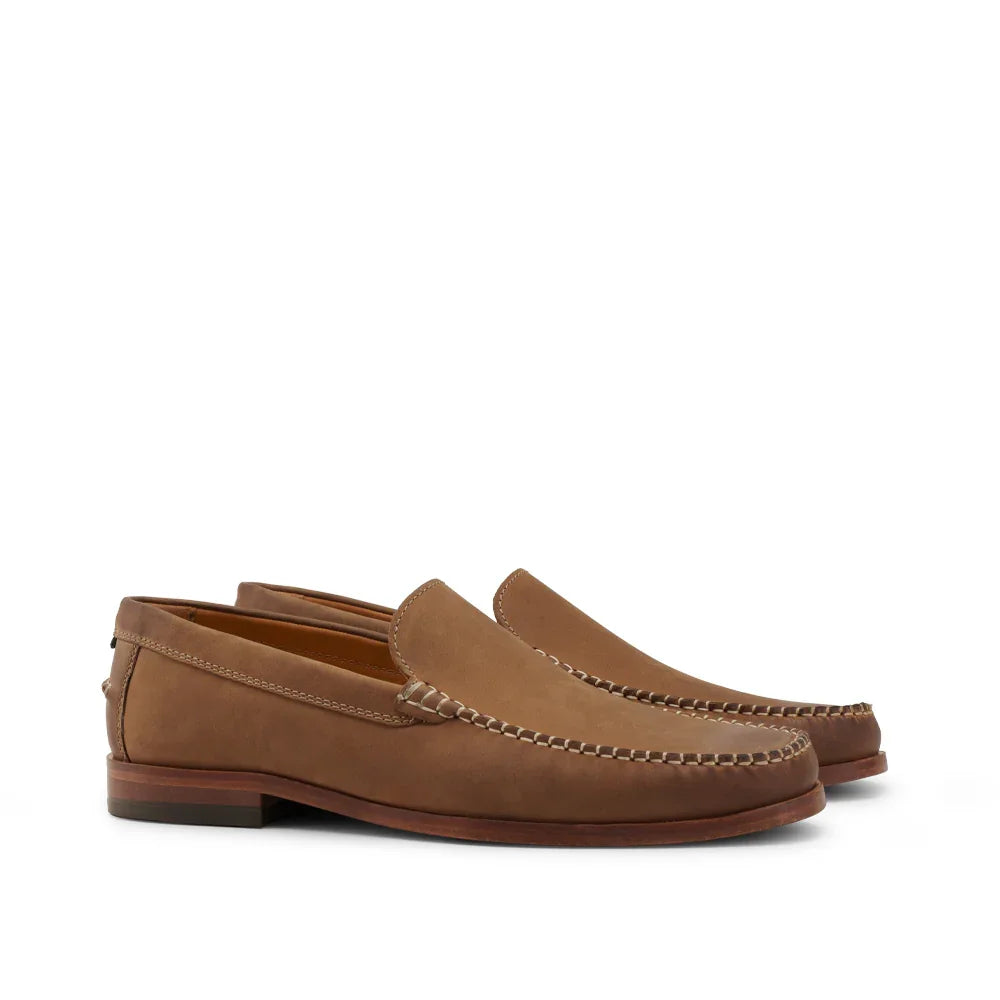 Men's clay brown leather loafers with moc toe stitching on white background