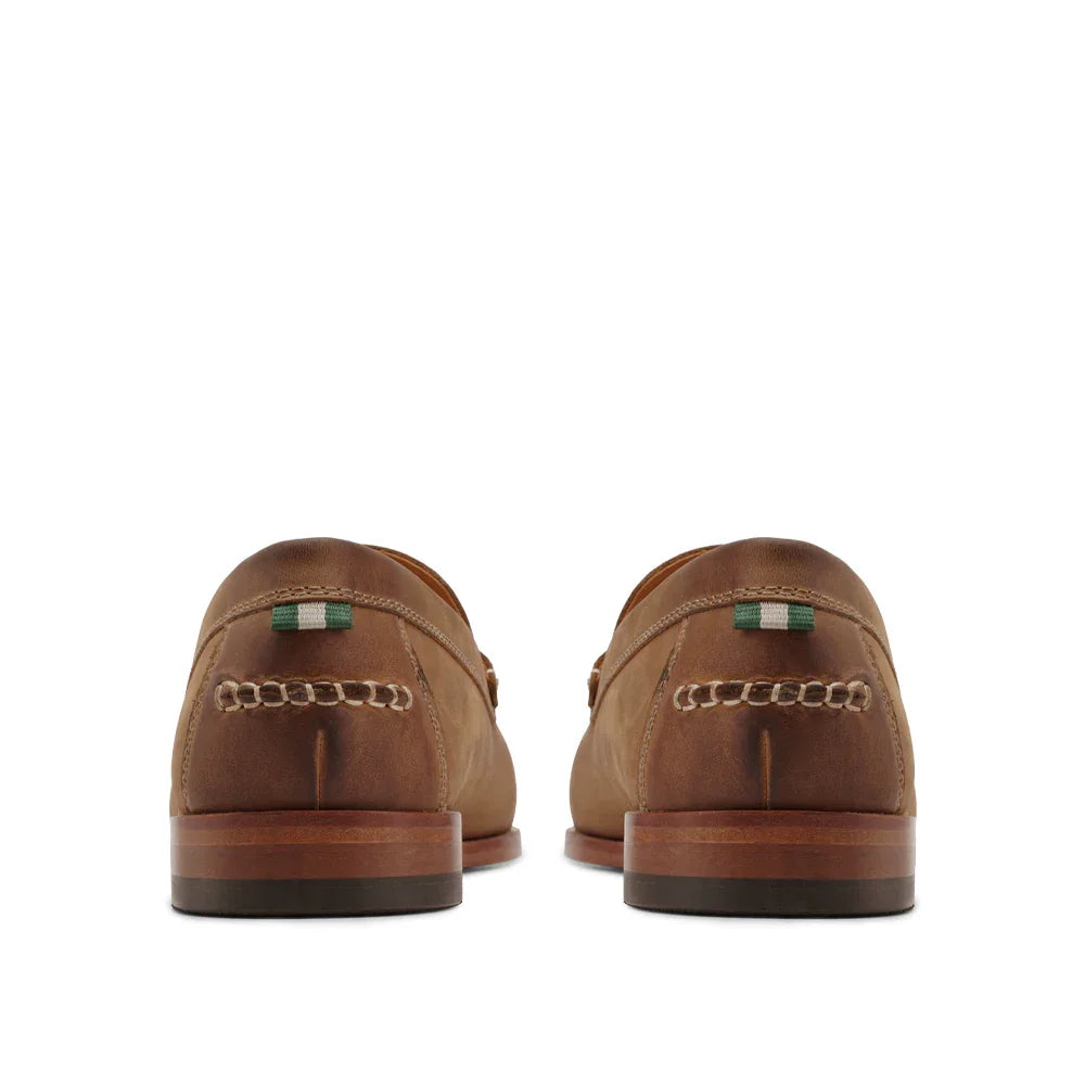 Back view of brown leather loafers with contrast stitching and green-striped heel tab