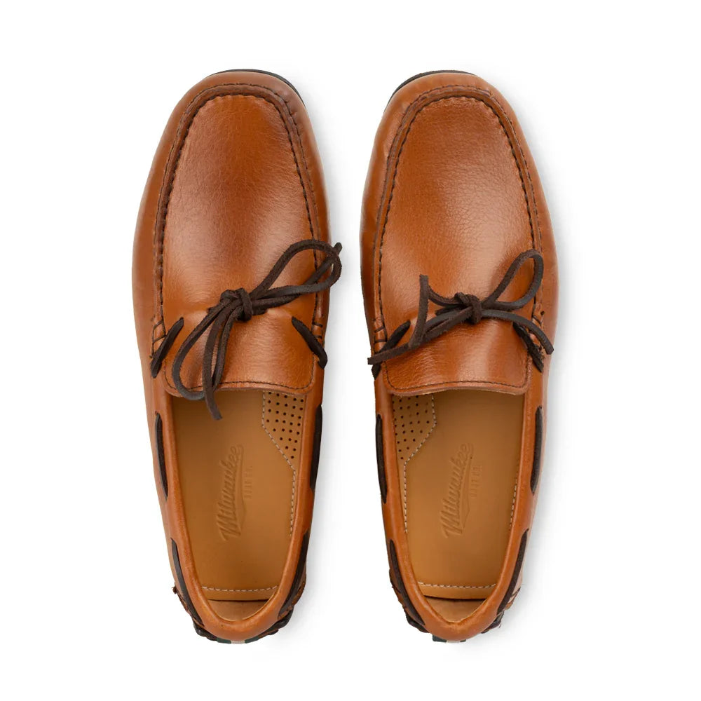 Top view of brown leather moc toe loafers with dark laces, classic men’s slip-on shoes