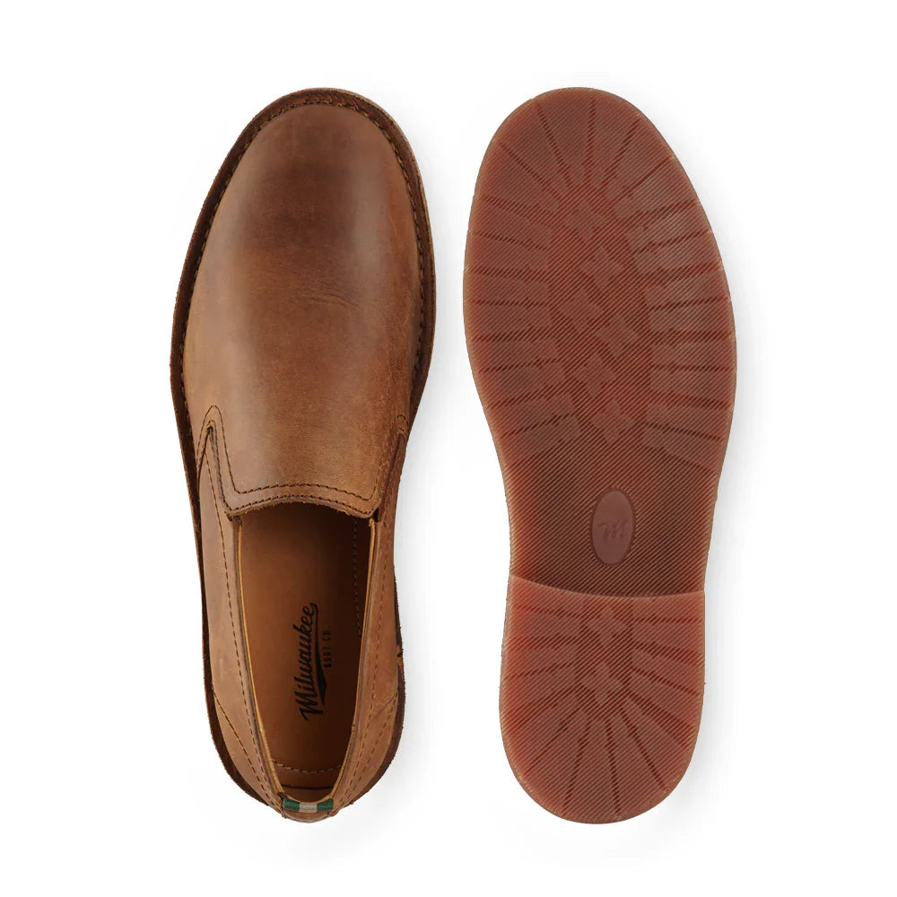 Brown leather slip-on shoe with rubber sole, shown top and bottom views on white background