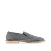 Gray suede slip-on loafer with light tan sole on white background