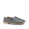 Pair of gray suede slip-on shoes with beige soles on a white background