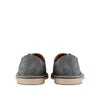 Back view of gray suede casual slip-on shoes with cream rubber soles on white background