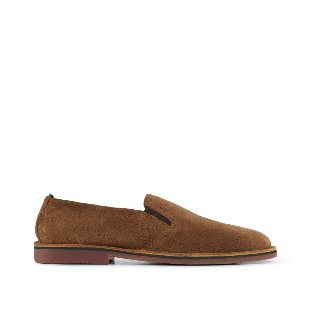 Brown suede slip-on loafer with flat sole, side profile on a white background