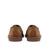 Rear view of brown suede casual shoes with visible stitching and rubber soles on white background.