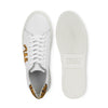 White leather sneaker with leopard print detail, flat lay showing top and sole.
