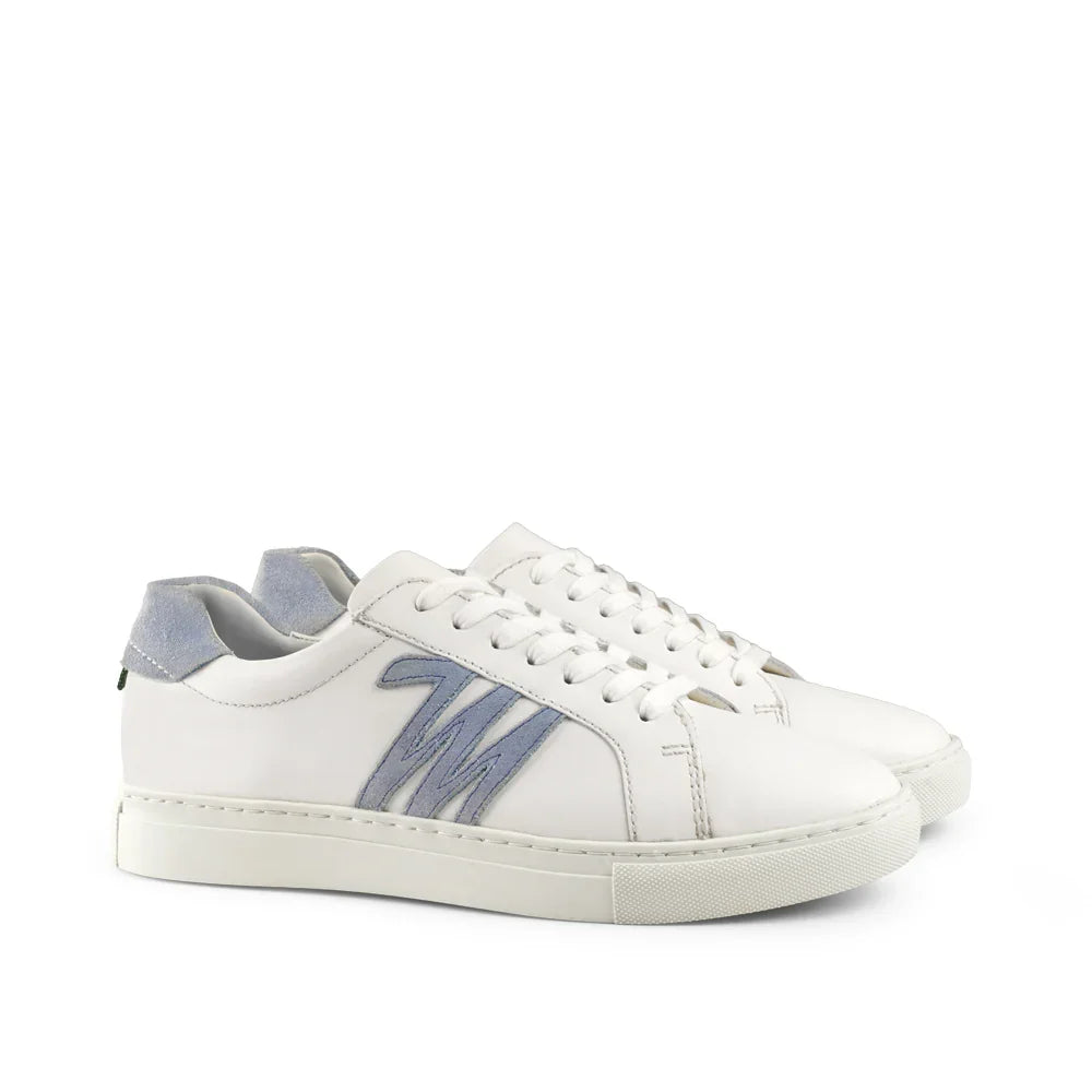 White low-top sneakers with light blue suede heel and side logo on a plain background