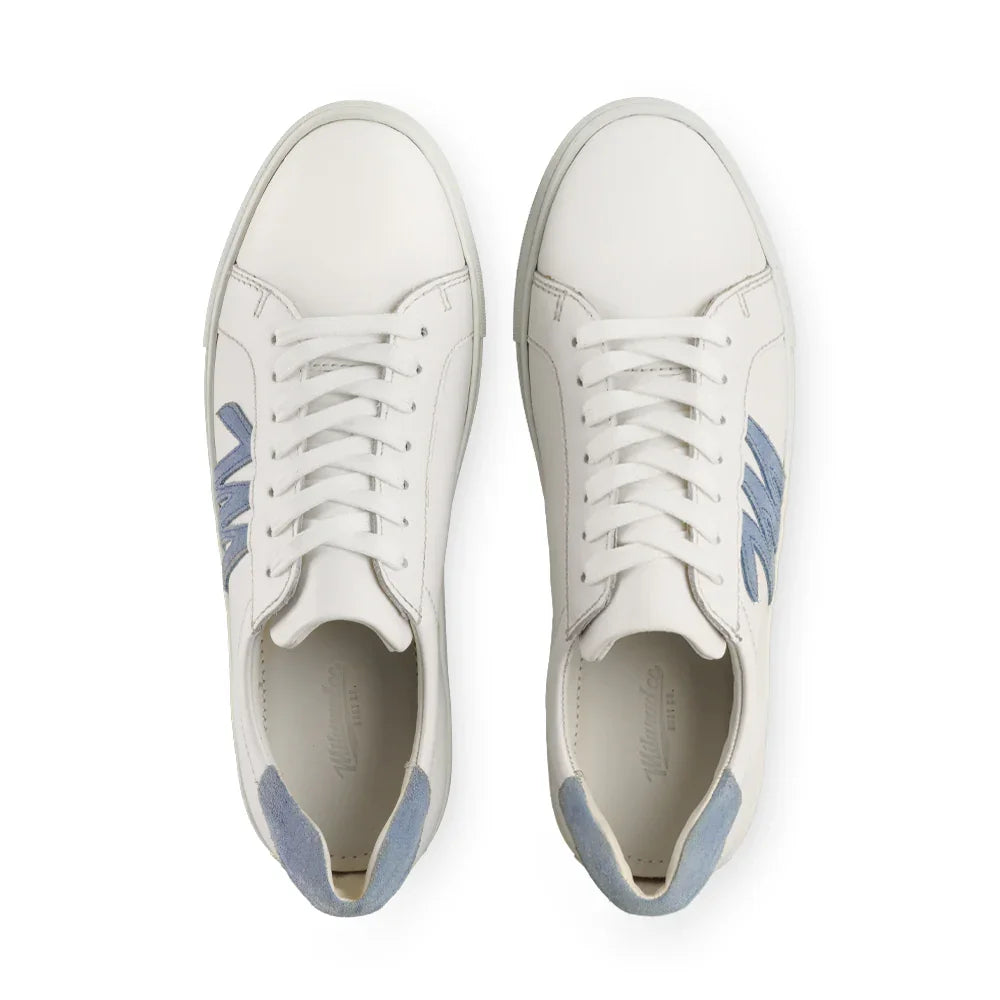 White leather sneakers with light blue suede heel accents and blue side detail, top view