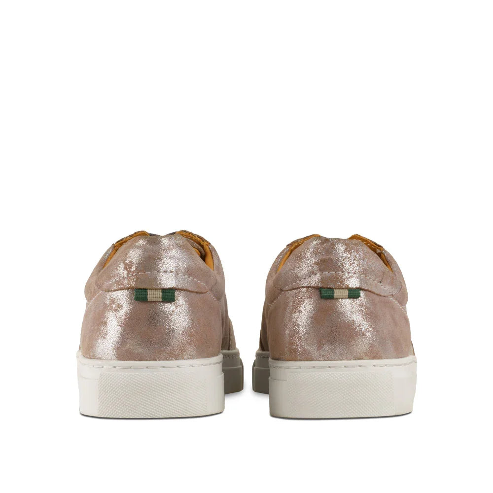 Back view of metallic pewter low-top sneakers with white soles on white background