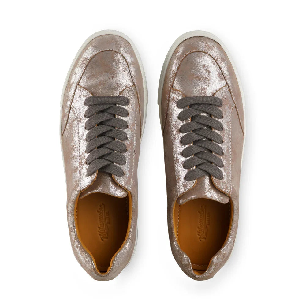 Metallic pewter leather sneakers with gray laces and white soles, top view