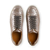 Metallic pewter leather sneakers with gray laces and white soles, top view