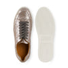 Metallic pewter leather sneaker with gray laces and textured white rubber sole, top view