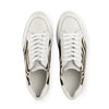 White low-top sneakers with zebra print side panels, top view on white background